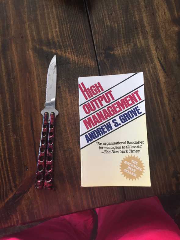 management book and box cutter